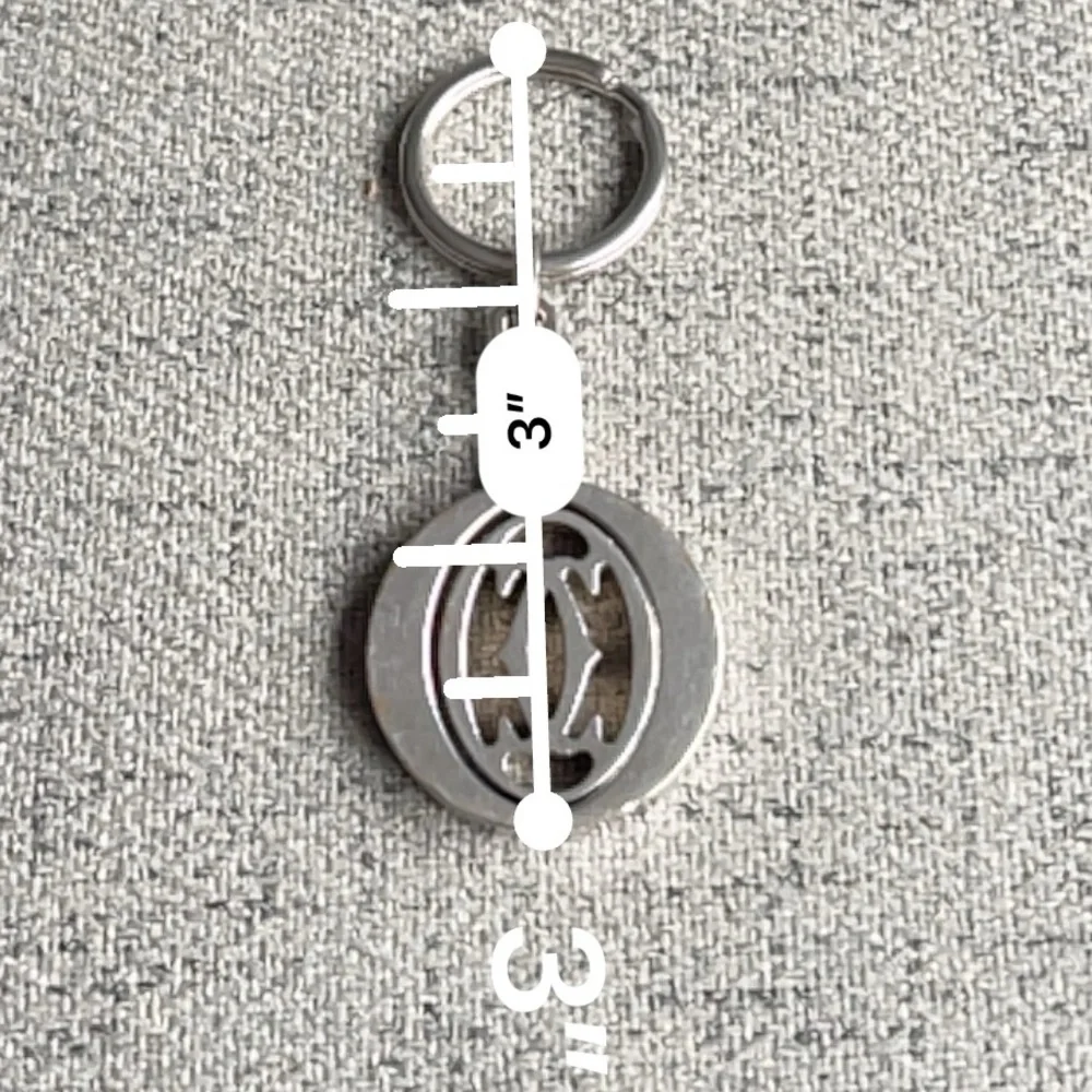 Cartier Silvertone stainless steel pivoting Double C key ring